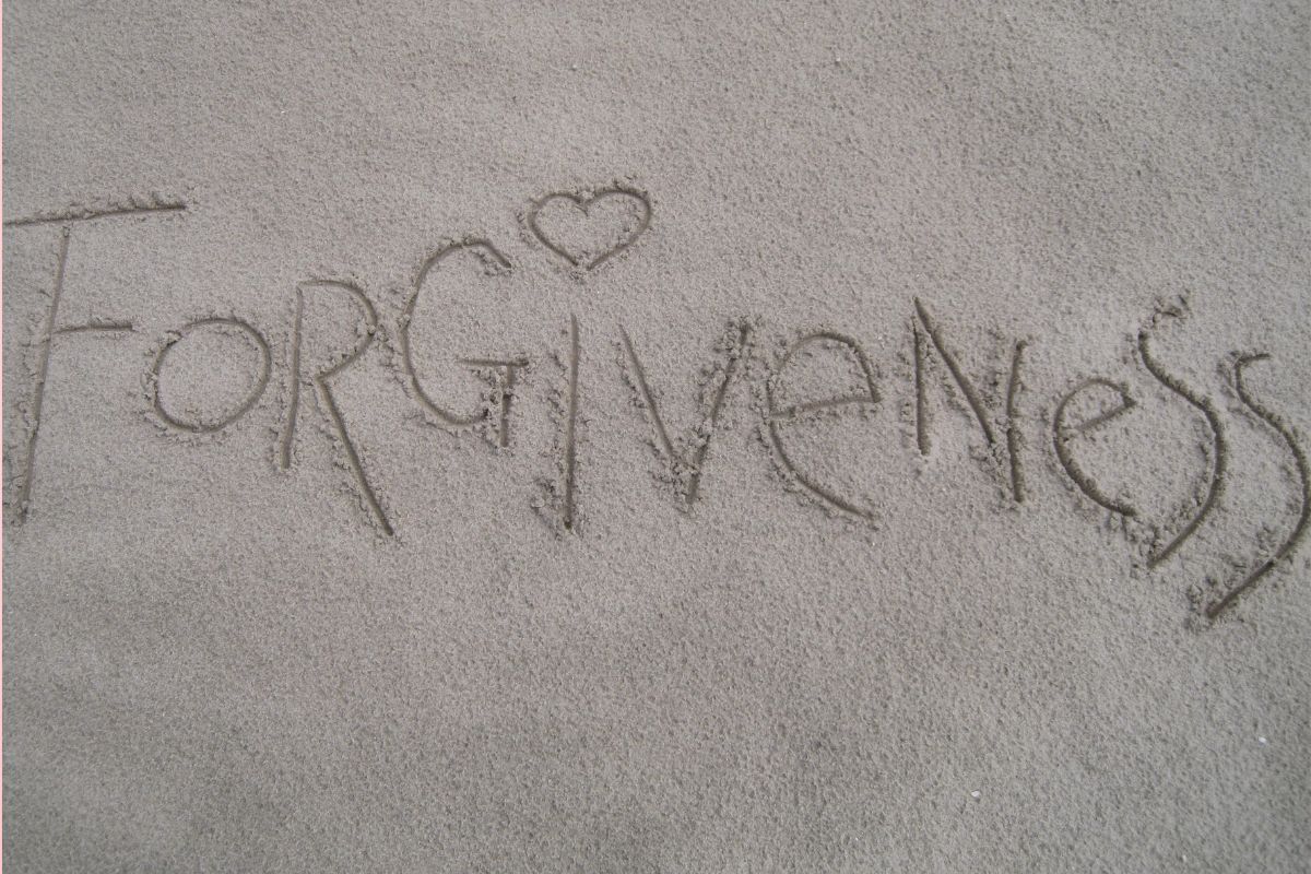 forgiveness written in sand